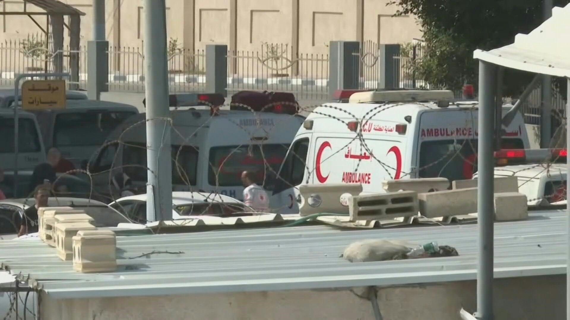 Ambulance vehicles transport wounded Gazans through Rafah crossing