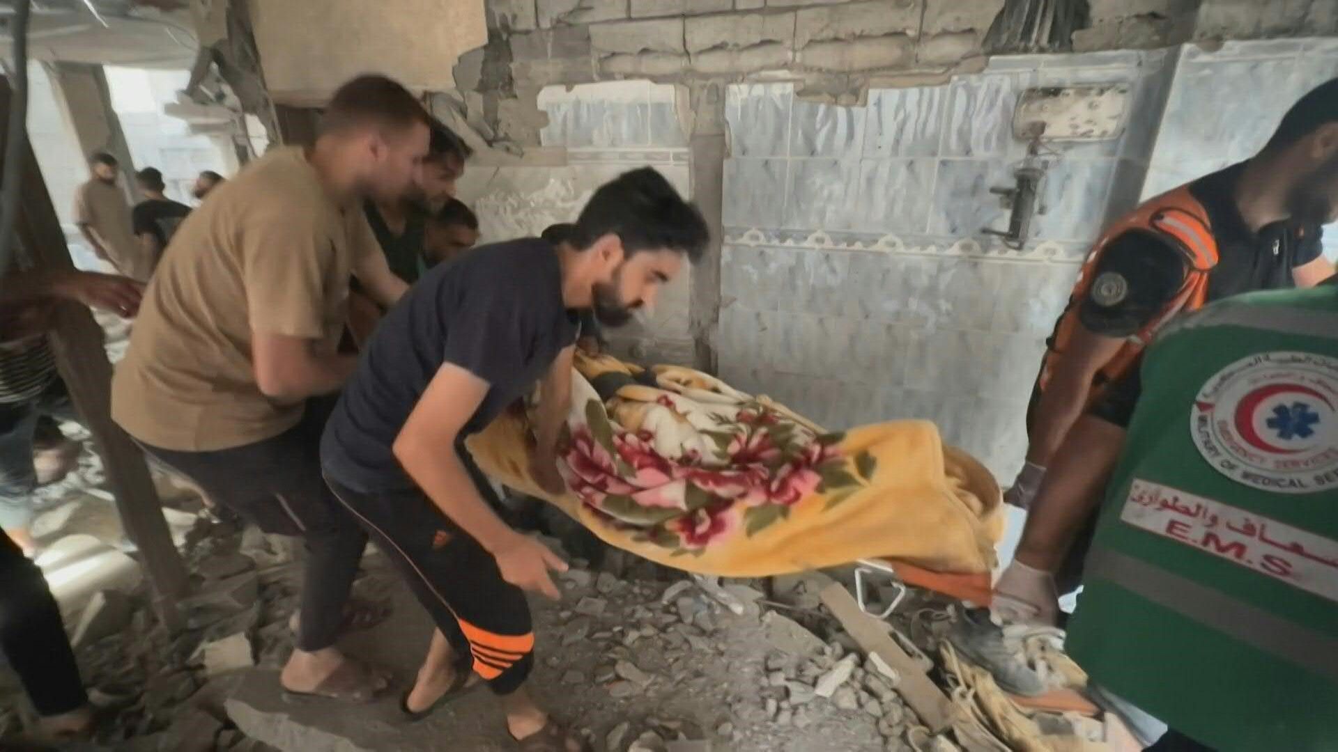 Bodies taken from damaged buildings in Khan Yunis