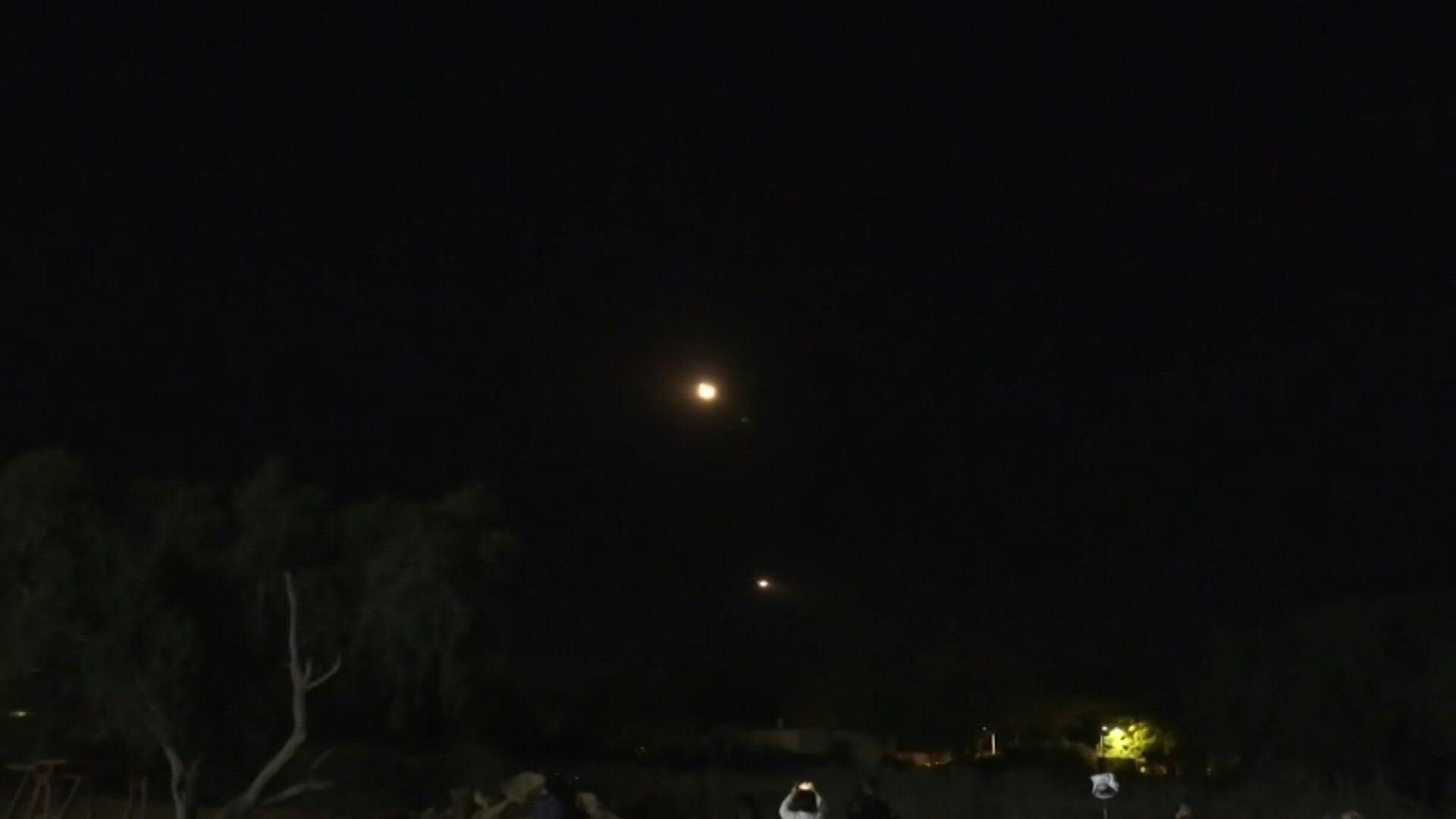 Helicopters transporting freed hostages fly over Israeli air base
