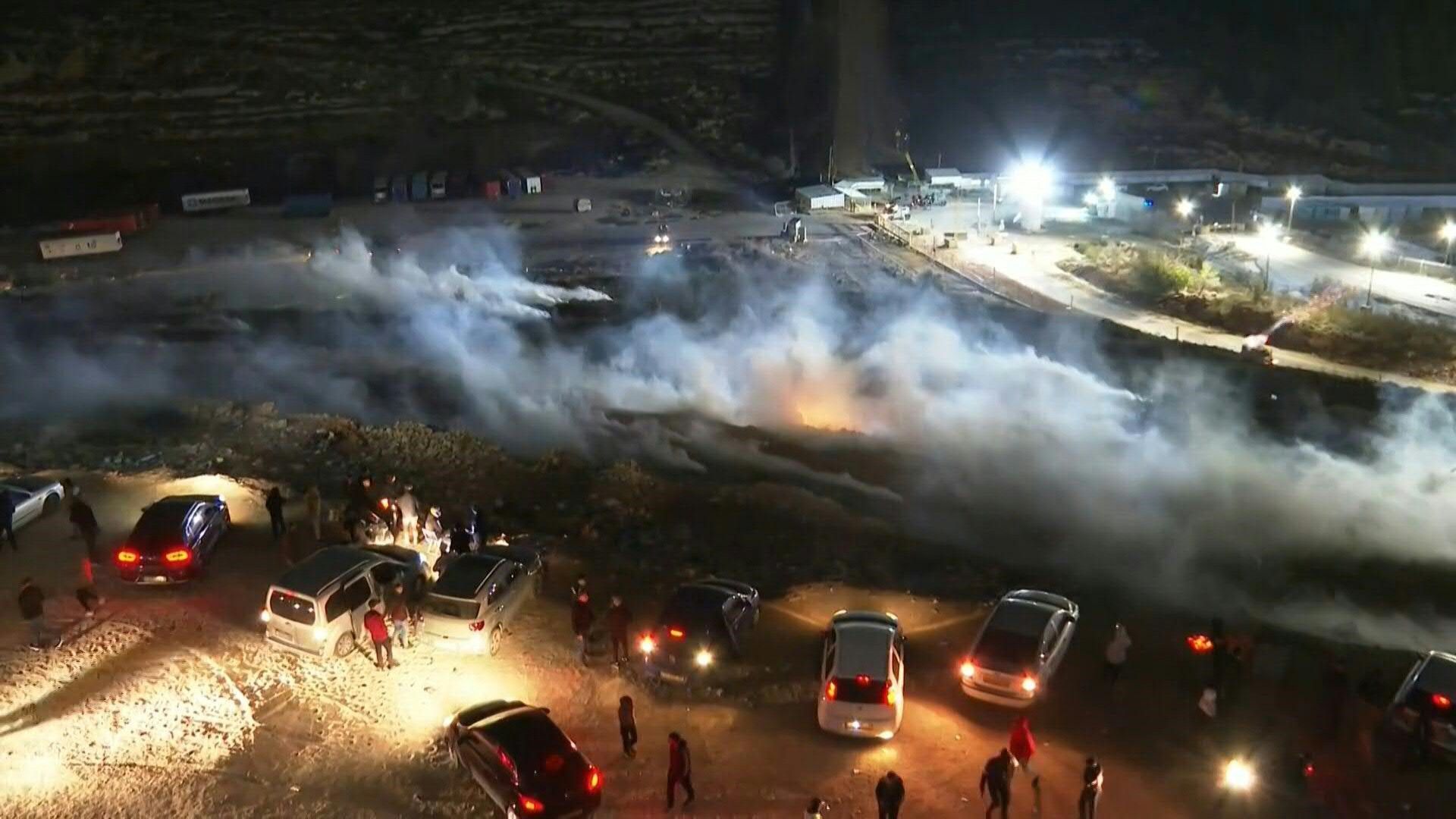 Israeli forces clash with Palestinians outside Ofer prison ahead of prisoner release