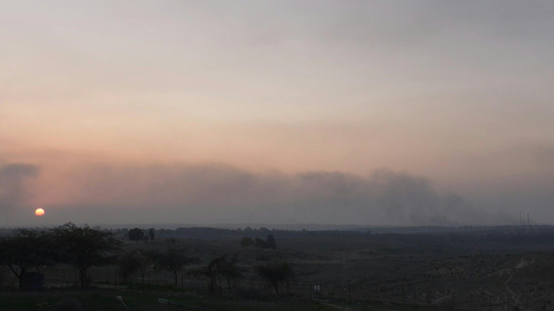 TIMELAPSE: Smoke billows, sun sets for last time of the year over central Gaza