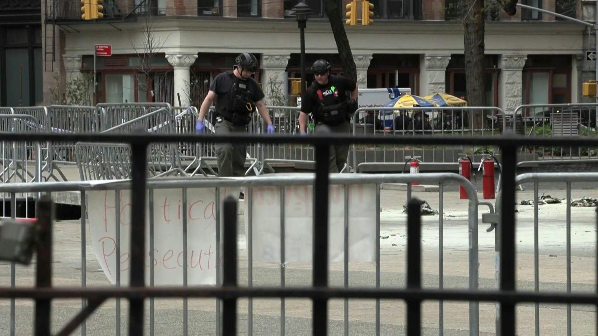 Police officers in park where man set himself on fire near Trump trial