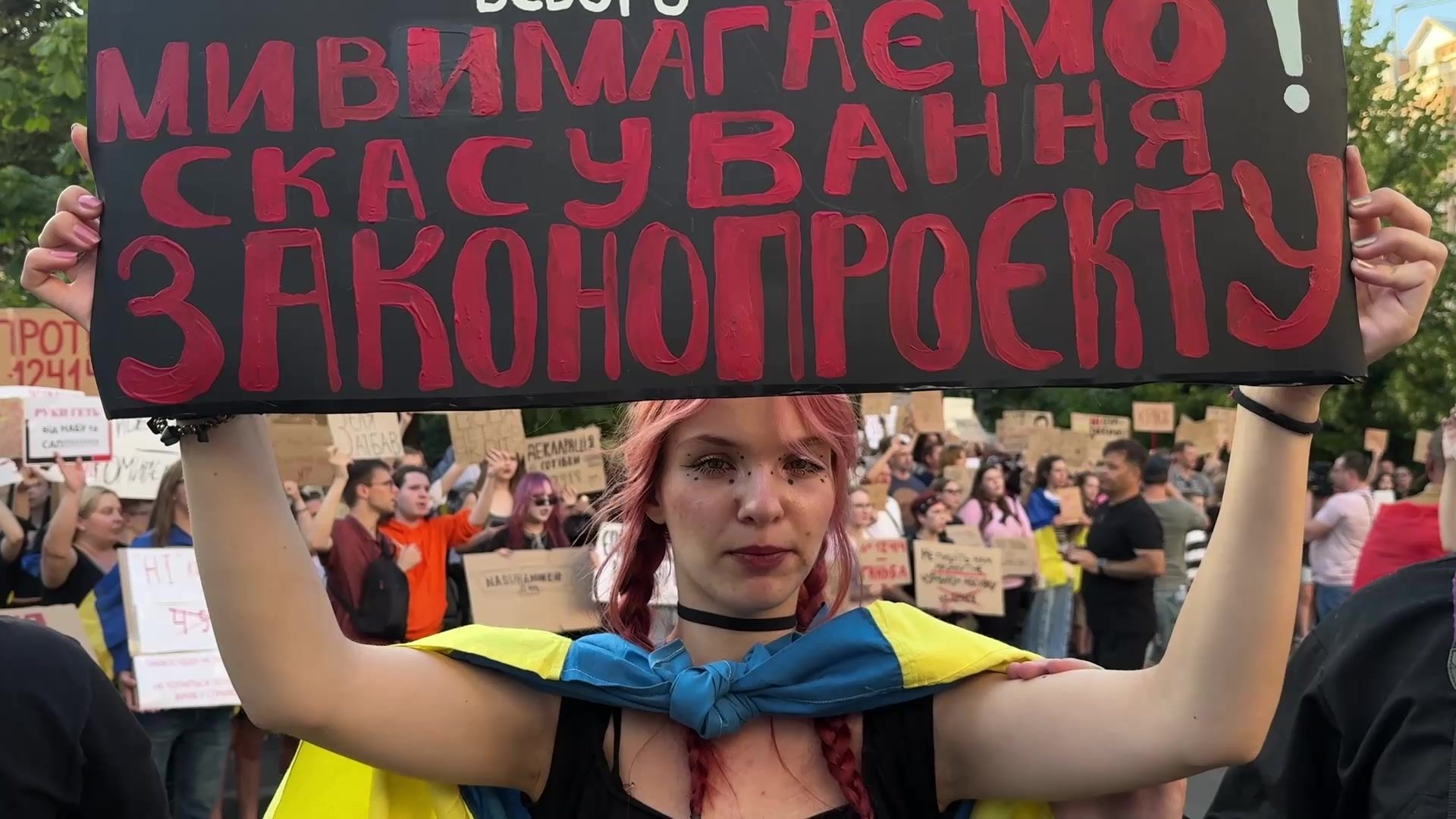 People gather in Kyiv to protest against law curbing anti-graft agencies