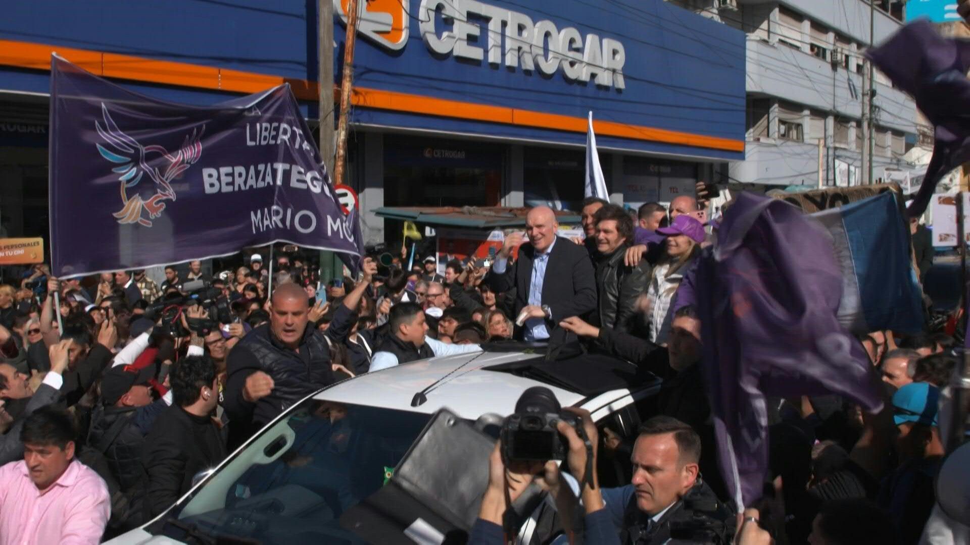 Video: President Milei drives off as protesters throw objects at his vehicle during rally