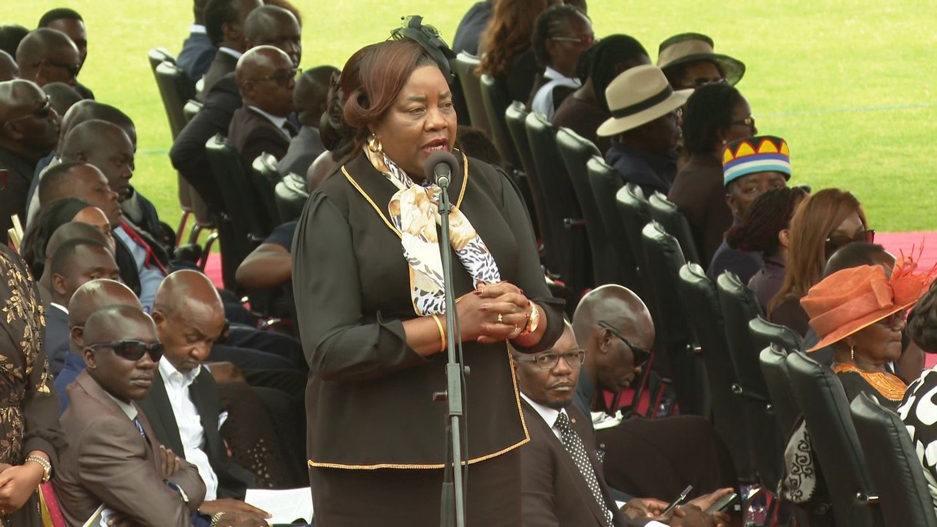 'We need peace' says wife of Kenyan opposition leader at his funeral