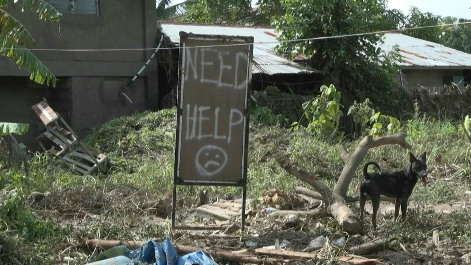 Typhoon Kalmaegi leaves damaged homes and thick mud in central Philippines