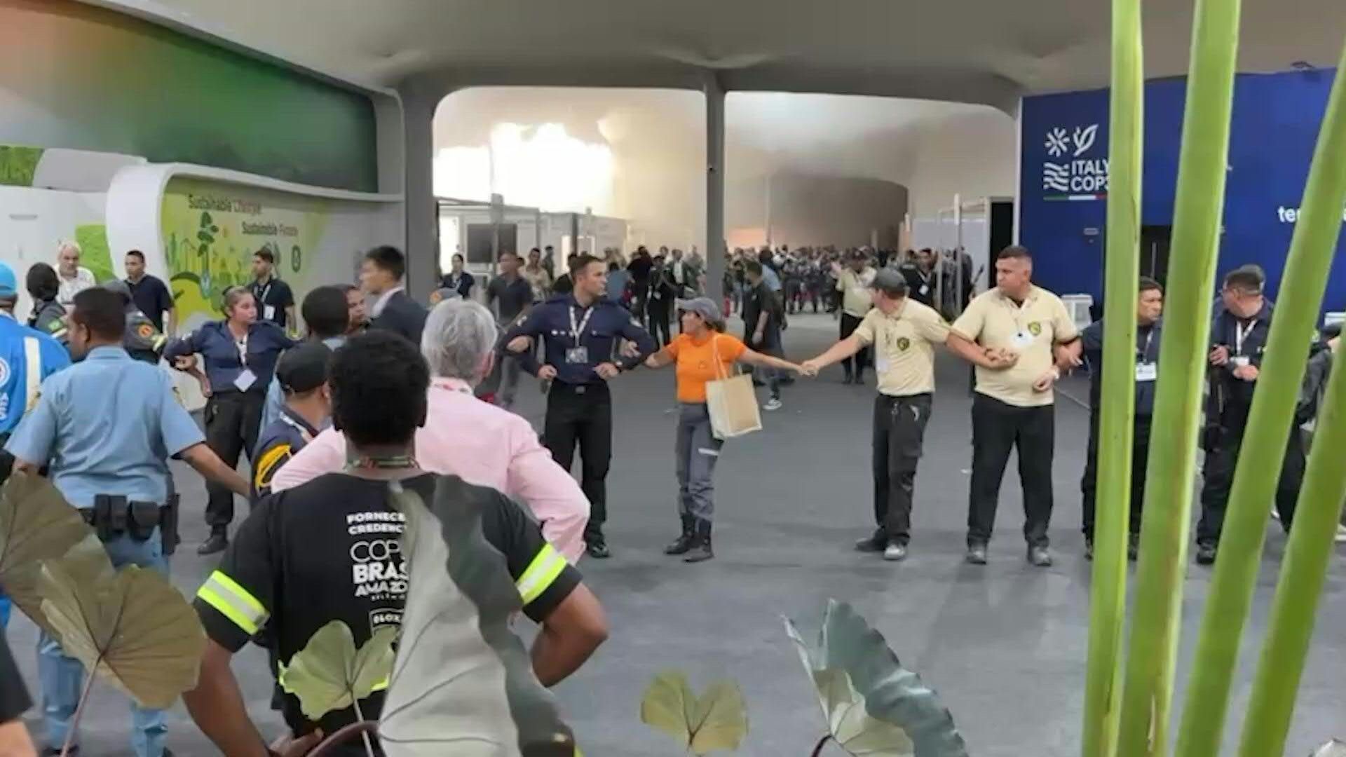 People evacuate as fire beaks out in pavilion at COP30 venue