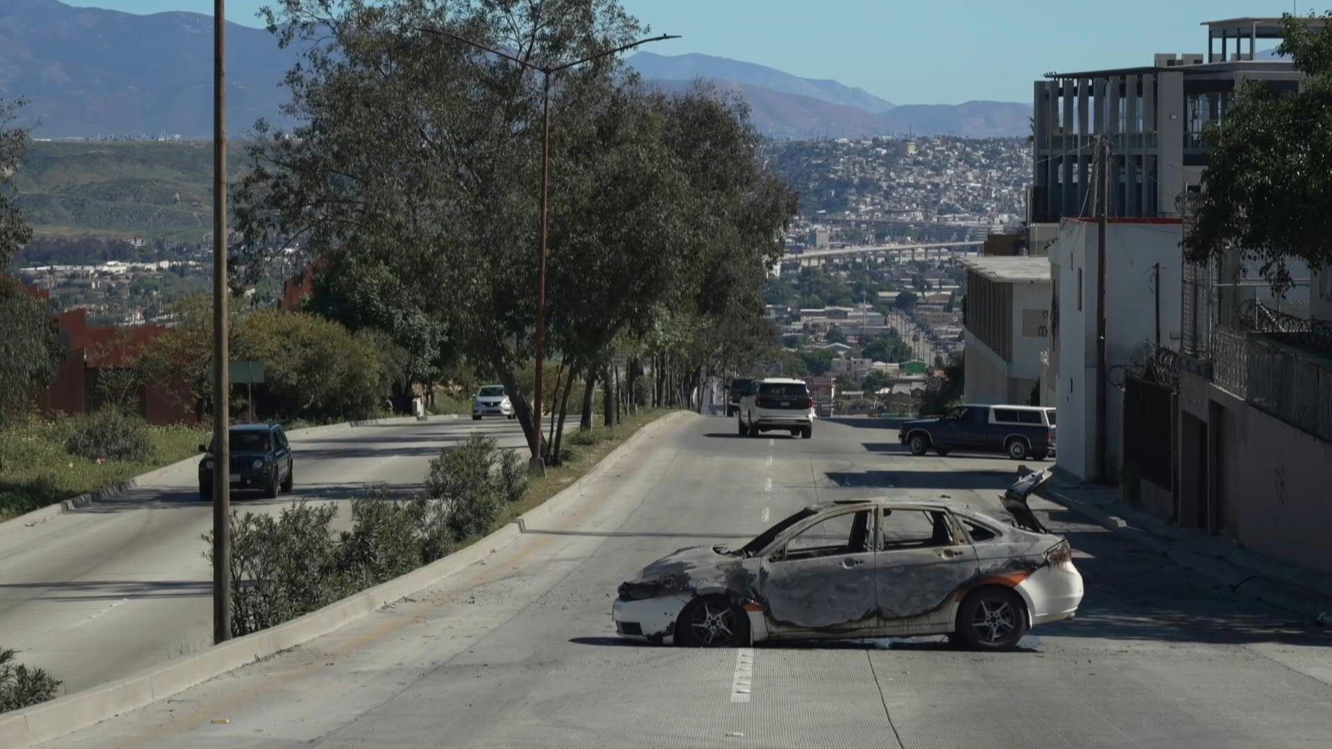 Video: Burned vehicles near US-Mexico border after drug kingpin killing