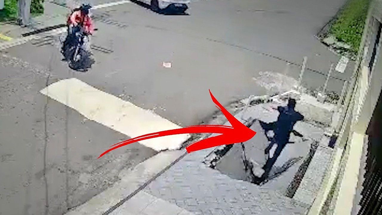 Shocking-moment-man-swallowed-by-collapsing-pavement-in-Brazil