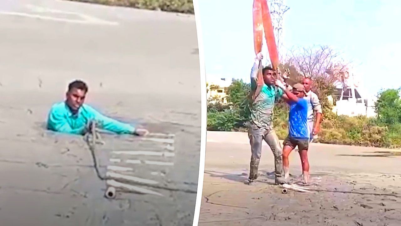 Man trapped up to neck in quicksand rescued in tense crane operation