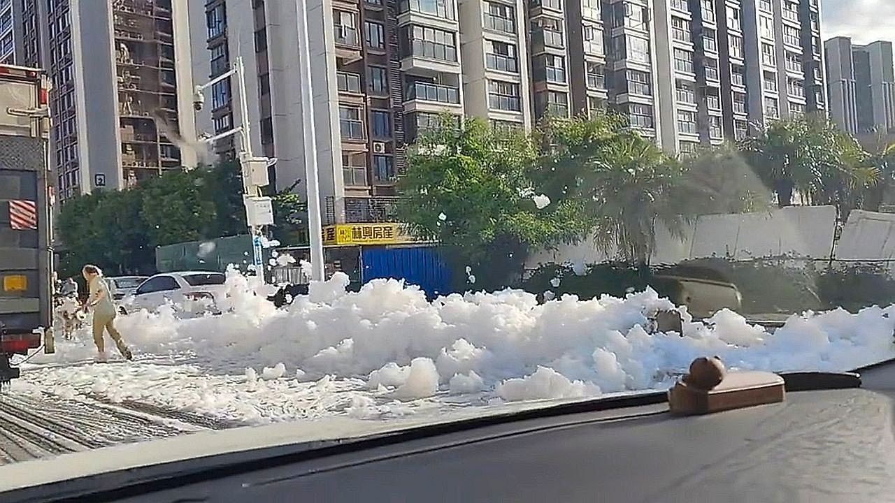 Foam blankets flooded streets after heavy rain
