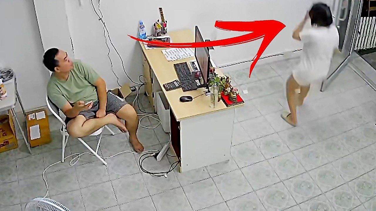 Woman-walks-into-wall-while-texting-in-Thailand