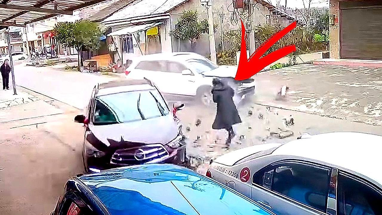 Video: Cars collide violently as pedestrian stands in their path