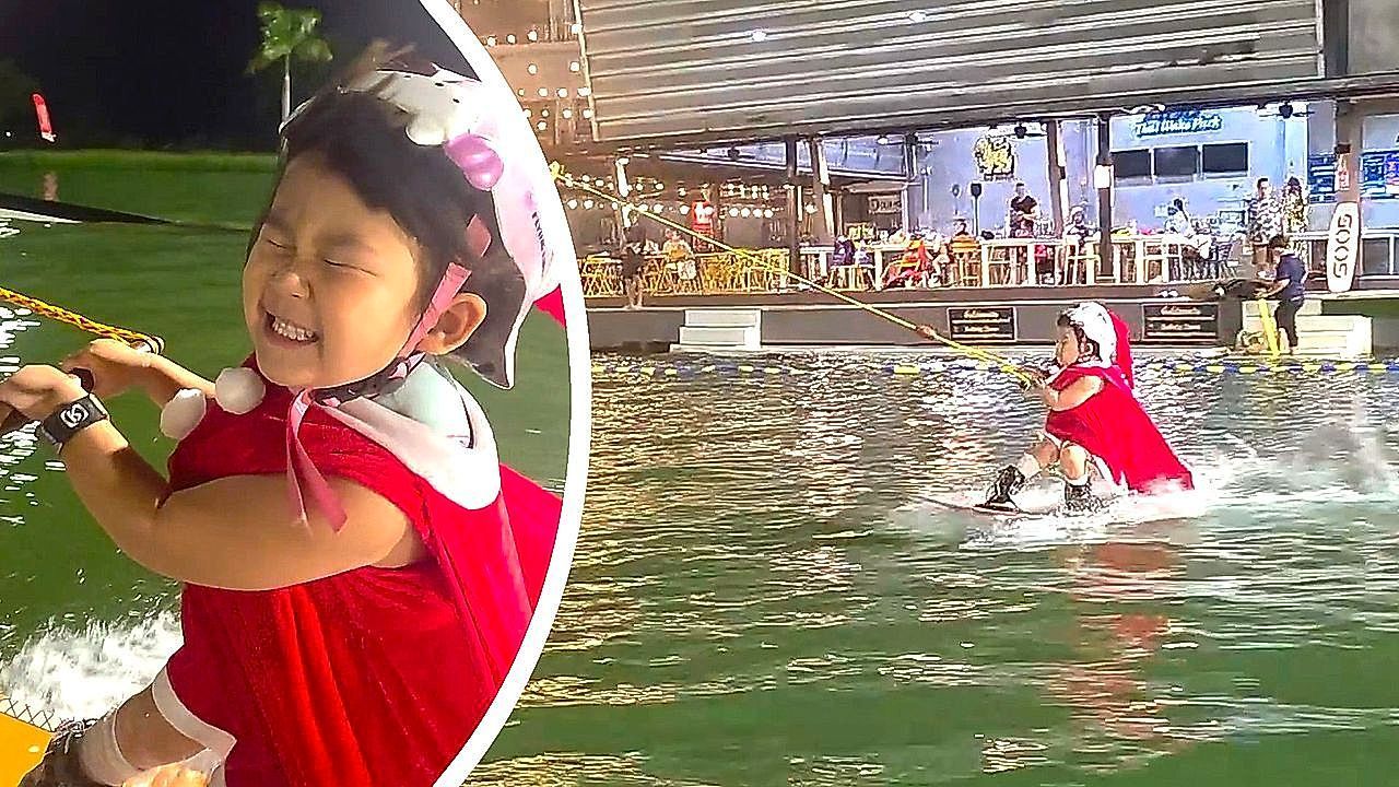 Video: This little 'Santa' knows how to ride the waves with amazing skill