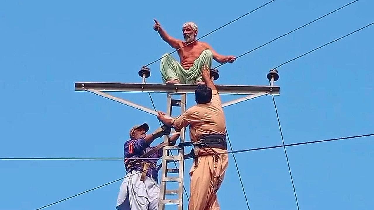 Man-climbs-high-voltage-pole-in-marriage-demand-sparking-hours-long-standoff