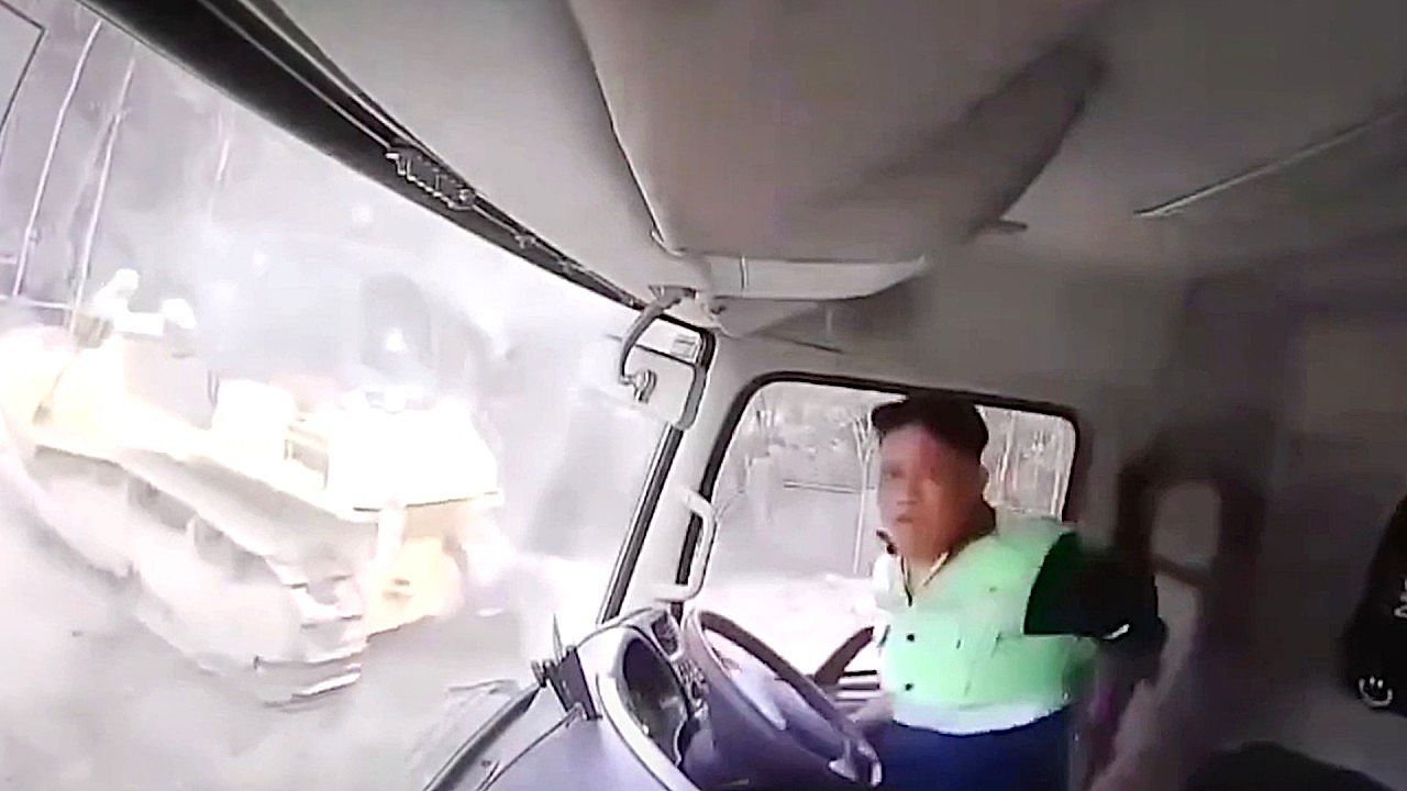 Video: Driver leaps from truck as landslide engulfs mine site in Indonesia