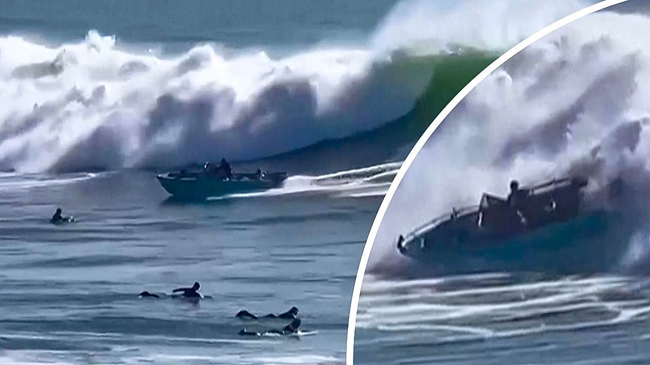 Video: Boot kentert in gewaltigen Wellen: Surfer retten sechsköpfige Familie