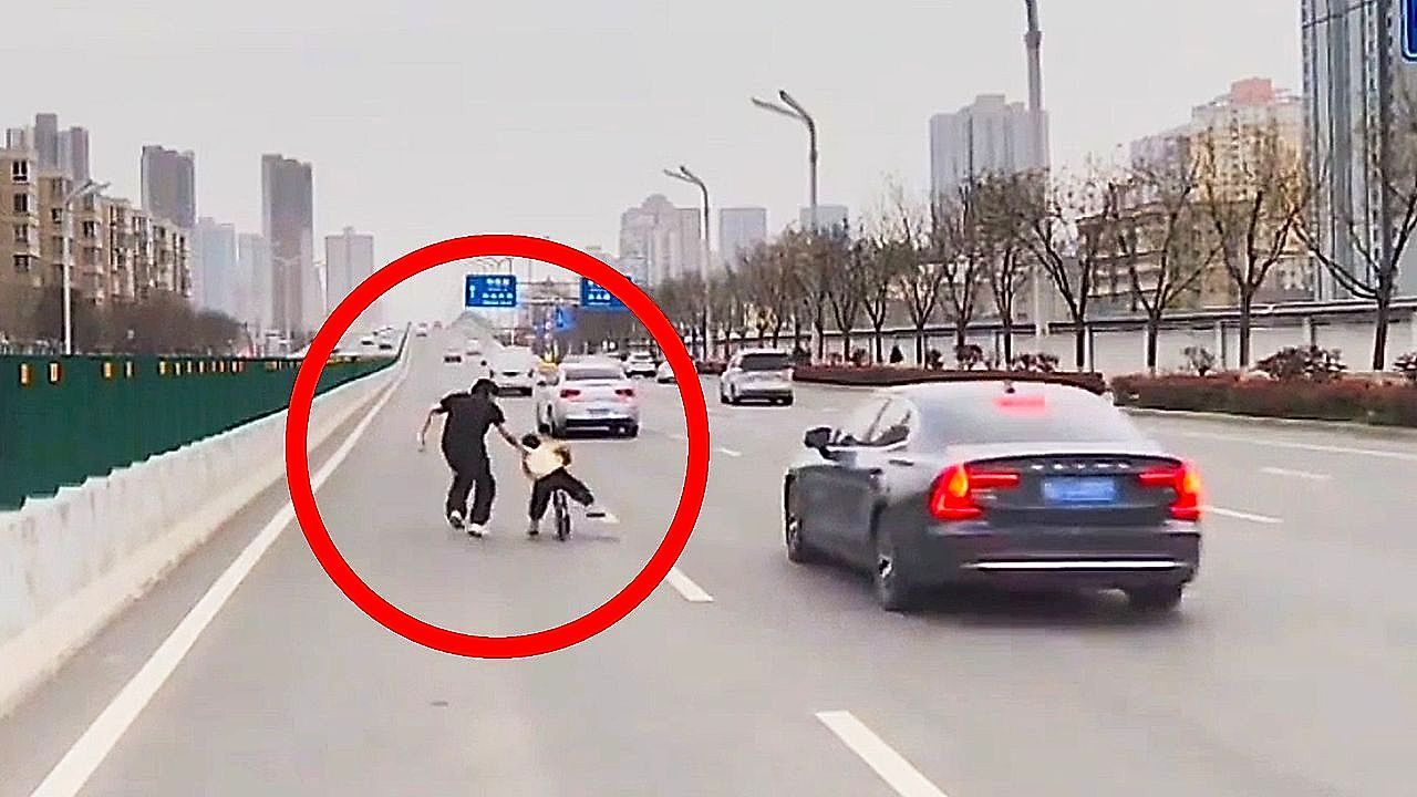 Video: Driver steps in as child rides balance bike into busy traffic in China