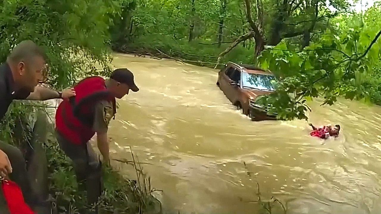 Video: Three rescued after vehicle swept into creek by flash floods in Indiana