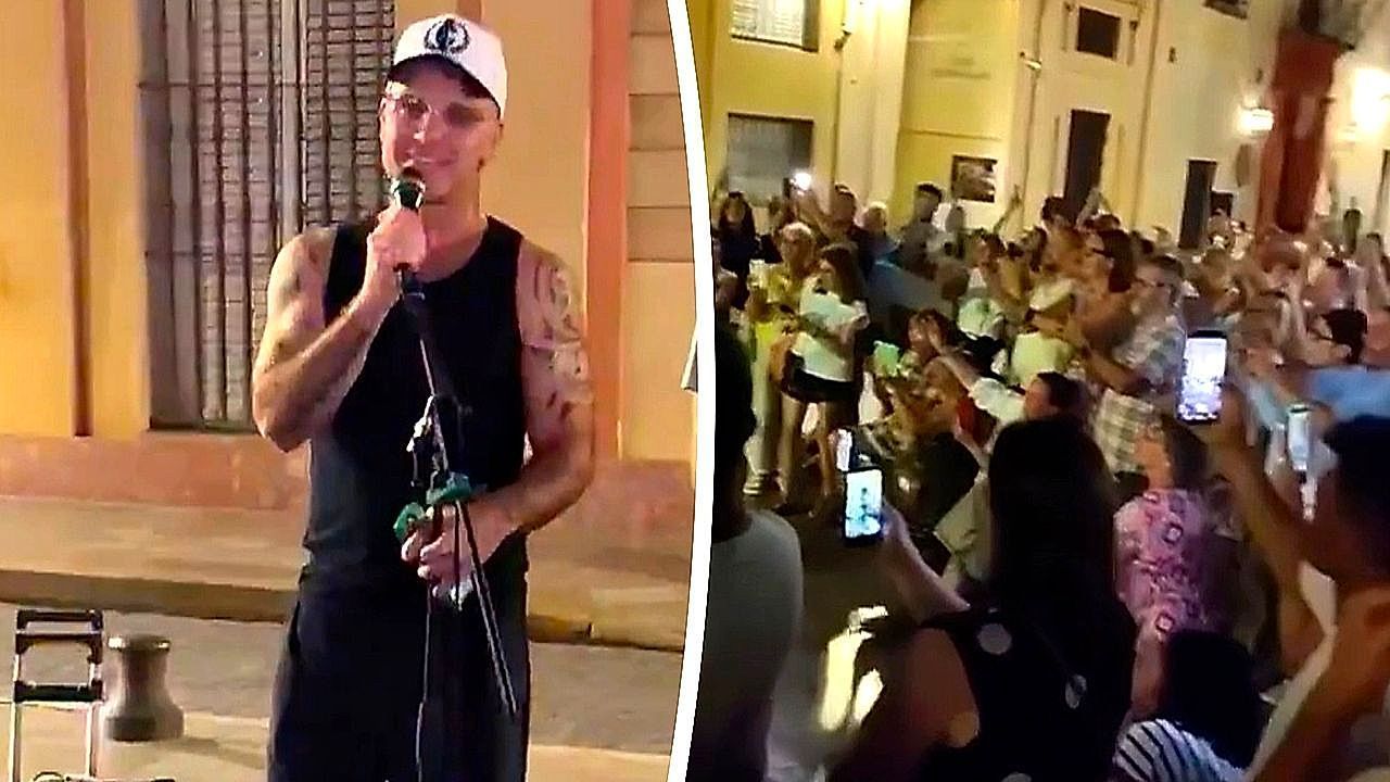 Video: Robbie Williams sings 'Angels' with street musician in surprise performance