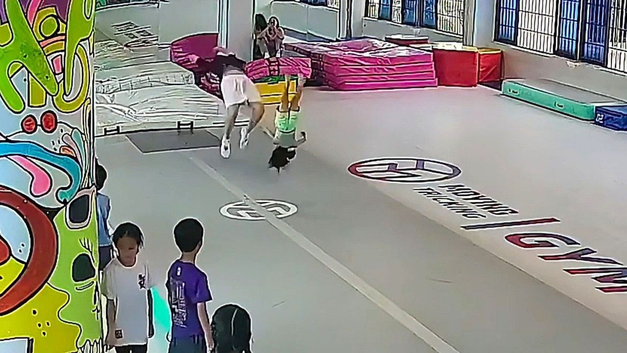 Gymnast catches little girl mid-backflip in split-second save