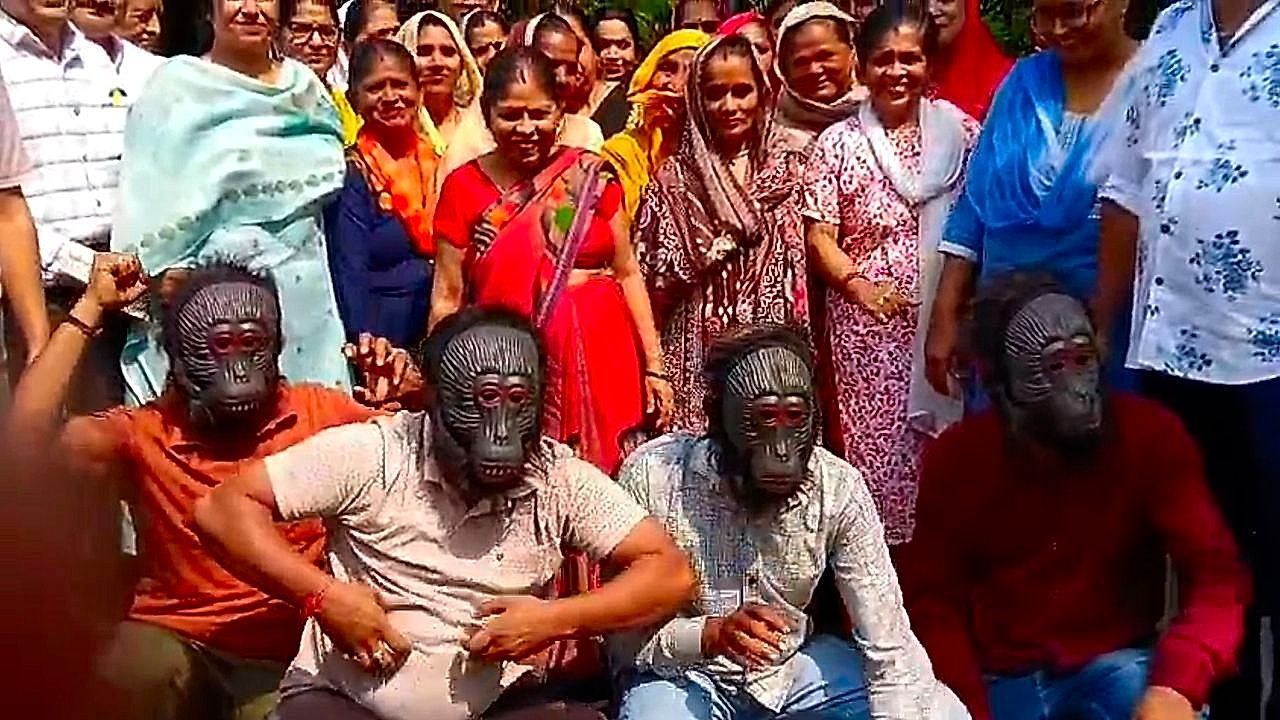 Video: Residents wear monkey masks to protest against repeated monkey attacks